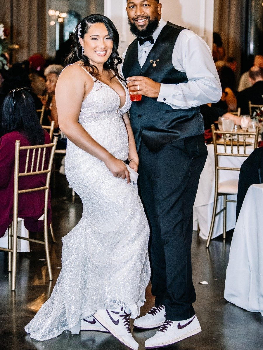 Bride and groom wear matching Jordans at their red and black wedding
